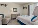 Cozy bedroom with a comfortable bed and sitting area at 8901 S Ukraine Ct, Aurora, CO 80016