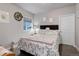Basement bedroom with floral bedding and a window at 8901 S Ukraine Ct, Aurora, CO 80016