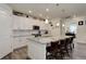 Modern kitchen with granite countertops and white cabinets at 8901 S Ukraine Ct, Aurora, CO 80016
