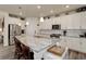 Modern kitchen with granite island and stainless steel appliances at 8901 S Ukraine Ct, Aurora, CO 80016