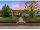 Charming single-story home with a well-maintained front yard and inviting walkway leading to the front door at 5125 Umatilla St, Denver, CO 80221
