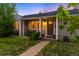 Cozy single-Gathering house with a welcoming front porch, mature trees, and a well-manicured lawn at 5125 Umatilla St, Denver, CO 80221