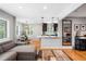 Bright and airy living space with an open layout, seamlessly connecting the living room, dining area, and kitchen at 5125 Umatilla St, Denver, CO 80221