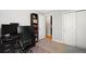 Bright office with a desk, a bookcase, and closet doors, ideal for working remotely at 5125 Umatilla St, Denver, CO 80221