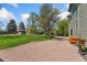 Beautifully landscaped backyard with lush green grass and mature trees at 185 S Hoyt St, Lakewood, CO 80226