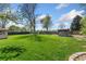 Spacious green backyard with mature trees, perfect for Gathering gatherings at 185 S Hoyt St, Lakewood, CO 80226
