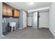 Finished basement area featuring utility sink, exposed ductwork and space at 185 S Hoyt St, Lakewood, CO 80226