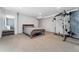 Basement featuring a bed, fitness equipment, neutral walls, and a carpeted floor at 185 S Hoyt St, Lakewood, CO 80226