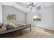 Bright bedroom with a vaulted ceiling, large windows, plush carpet, and neutral colored walls at 185 S Hoyt St, Lakewood, CO 80226