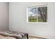 Bright bedroom featuring neutral walls, plush carpet, and a window with a view of the outdoors at 185 S Hoyt St, Lakewood, CO 80226