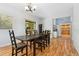 Bright dining room features a large dining table and wood floors at 185 S Hoyt St, Lakewood, CO 80226