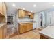 Galley kitchen featuring wooden cabinets and tile floors at 185 S Hoyt St, Lakewood, CO 80226