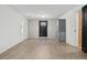 Living room with wood floors, light walls, and exterior doors at 185 S Hoyt St, Lakewood, CO 80226