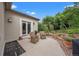 Outdoor patio featuring seating, a walkway and mature trees at 1999 Champions Cir, Castle Rock, CO 80104