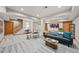 Spacious basement with ample seating and stairs to the upper level at 1999 Champions Cir, Castle Rock, CO 80104