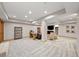 Finished basement featuring neutral paint, plush gray carpet, desk with workspace and tv area at 1999 Champions Cir, Castle Rock, CO 80104