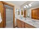 Bright bathroom with double vanity sinks and a shower at 1999 Champions Cir, Castle Rock, CO 80104