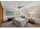 Comfortable bedroom with soft lighting and a ceiling fan at 1999 Champions Cir, Castle Rock, CO 80104