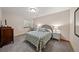 Cozy bedroom featuring natural light, a full bed and decorative pillows at 1999 Champions Cir, Castle Rock, CO 80104