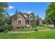 Charming home with stone accents, mature trees, and manicured lawn in a desirable neighborhood at 1999 Champions Cir, Castle Rock, CO 80104