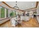 Open concept kitchen with an island, stainless steel appliances, a dining nook and hardwood floors at 1999 Champions Cir, Castle Rock, CO 80104