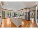 Spacious kitchen with hardwood floors, center island, stainless steel appliances, and breakfast nook at 1999 Champions Cir, Castle Rock, CO 80104