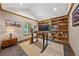 Inviting home office with built-in bookshelves and a standing desk at 1999 Champions Cir, Castle Rock, CO 80104
