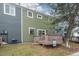 This townhouse features a charming, wooden back deck with a 