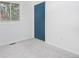 Minimalist bedroom with neutral carpet, a blue closet door, window and ample natural light at 1595 Macarthur Dr, Boulder, CO 80303