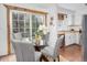 Eat-in kitchen with table and chairs, stainless steel dishwasher, and sliding glass door at 1595 Macarthur Dr, Boulder, CO 80303