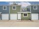 Townhome exterior with multi-tone paint and attached garages at 1595 Macarthur Dr, Boulder, CO 80303