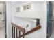 Staircase with wood railing and white walls at 1595 Macarthur Dr, Boulder, CO 80303