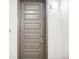 Apartment door with number 307, featuring modern design and electronic lock at 487 Interlocken Blvd # 307, Broomfield, CO 80021