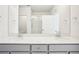 Spacious double vanity bathroom with lots of mirrors and a large walk in shower at 487 Interlocken Blvd # 307, Broomfield, CO 80021