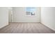 Bright bedroom featuring neutral carpet, a window providing natural light, and a freshly painted white wall at 487 Interlocken Blvd # 307, Broomfield, CO 80021
