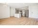 Open kitchen and living space featuring stainless steel appliances, ample cabinet space, and light-colored wood flooring at 487 Interlocken Blvd # 307, Broomfield, CO 80021
