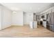 Open concept kitchen with modern appliances and island, seamlessly flowing into living area at 487 Interlocken Blvd # 307, Broomfield, CO 80021