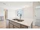 Modern kitchen featuring stainless steel appliances, a double sink, and sleek countertops at 487 Interlocken Blvd # 307, Broomfield, CO 80021