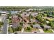 Aerial view of a neighborhood close to a lake showcasing houses with lush landscaping and mature trees at 2582 Beech Ct, Golden, CO 80401