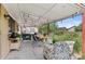 Inviting back patio with a dining table, grill, comfortable seating, and overhead string lights at 2582 Beech Ct, Golden, CO 80401