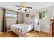 Sunlit bedroom features hardwood floors, two windows and neutral walls at 2582 Beech Ct, Golden, CO 80401