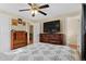 Bedroom featuring a ceiling fan, closet, and a dresser with a television at 2582 Beech Ct, Golden, CO 80401