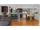 Modern kitchen with stainless steel appliances, a breakfast bar, and an adjacent dining area filled with sunlight at 2582 Beech Ct, Golden, CO 80401