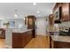 Contemporary kitchen with stainless appliances, granite countertops, and seamless flow into the living area at 2582 Beech Ct, Golden, CO 80401