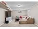 Spacious living room with plush carpeting, recessed lights, and a wall-mounted television at 2582 Beech Ct, Golden, CO 80401