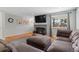 Comfortable living room with a gray fireplace and a large window providing natural light and neighborhood views at 2582 Beech Ct, Golden, CO 80401