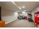 Finished basement with a couch, treadmill and carpeted floors at 7076 S Niagara Ct, Centennial, CO 80112