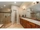Luxurious bathroom with glass shower and dual vanity sinks at 7076 S Niagara Ct, Centennial, CO 80112