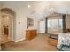 Bright bedroom showcasing vaulted ceilings, a chandelier, and access to bathroom at 7076 S Niagara Ct, Centennial, CO 80112