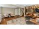 Welcoming living room with hardwood floors, stairs to second floor and seating area at 7076 S Niagara Ct, Centennial, CO 80112